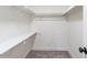 Carpeted walk in closet with built in shelves at 13438 N 18Th Ln, Phoenix, AZ 85029