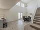 Open-concept dining area with contemporary decor, adjoining the staircase and kitchen at 13438 N 18Th Ln, Phoenix, AZ 85029