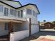 Side view of charming two-story home with balcony and attached two-car garage at 13438 N 18Th Ln, Phoenix, AZ 85029