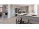 Contemporary kitchen featuring gray cabinets, stainless appliances, and a breakfast bar with seating at 13438 N 18Th Ln, Phoenix, AZ 85029