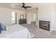 Cozy main bedroom with fireplace, walk-in closet, and neutral decor at 13438 N 18Th Ln, Phoenix, AZ 85029