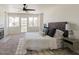 Bright main bedroom with fireplace, ceiling fan, and outside balcony access at 13438 N 18Th Ln, Phoenix, AZ 85029