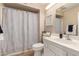 Bathroom featuring large mirror, modern sink and vanity with a shower/tub combo at 13644 W Aleppo Dr, Sun City West, AZ 85375