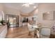 Bright dining area offering a glass table and seamless access to the backyard at 13644 W Aleppo Dr, Sun City West, AZ 85375