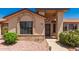 Close up of single-story home showcasing the front door with desert landscaping and a concrete walkway at 13644 W Aleppo Dr, Sun City West, AZ 85375