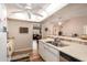 Well-lit kitchen leading to a comfortable living area and featuring modern appliances at 13644 W Aleppo Dr, Sun City West, AZ 85375