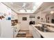 Efficient kitchen with essential appliances and an easy transition to the living area at 13644 W Aleppo Dr, Sun City West, AZ 85375