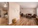 Open-concept living room with wood floors and neutral colors, providing an inviting and comfortable space at 13644 W Aleppo Dr, Sun City West, AZ 85375