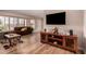 Inviting living room featuring wood-look floors and large windows with natural light at 13644 W Aleppo Dr, Sun City West, AZ 85375