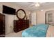 The main bedroom features carpet flooring, dresser with mirror, and ensuite bathroom at 13644 W Aleppo Dr, Sun City West, AZ 85375