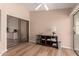 Bright office space with wood floors, slider to back patio, and space for storage at 13644 W Aleppo Dr, Sun City West, AZ 85375
