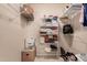 Spacious walk-in closet providing ample storage with built-in shelving and storage solutions at 13644 W Aleppo Dr, Sun City West, AZ 85375