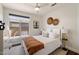 Bright bedroom features a decorative headboard, modern ceiling fan and a beautiful neutral color palette at 15020 N 54Th Pl, Scottsdale, AZ 85254