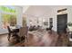 Bright living room featuring high ceilings, large windows, hardwood floors, and elegant furnishings at 15020 N 54Th Pl, Scottsdale, AZ 85254