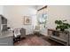 Bright and airy office features a large window, neutral colors and modern decor at 15020 N 54Th Pl, Scottsdale, AZ 85254