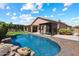 Inviting backyard pool surrounded by lush landscaping and covered patio at 15020 N 54Th Pl, Scottsdale, AZ 85254
