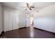 This bedroom boasts wood-look tile flooring and a ceiling fan at 1551 E Glencove St, Mesa, AZ 85203