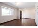 The living room features wood-look tile flooring and a window providing natural light at 1551 E Glencove St, Mesa, AZ 85203