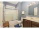 Bathroom with a tub, vanity and sink offering function and comfort at 16287 W Willow Creek Ln, Surprise, AZ 85374