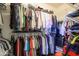 Walk-in closet with shelving and hanging space maximizing storage potential at 16287 W Willow Creek Ln, Surprise, AZ 85374