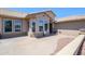 The exterior showcases neutral stucco, well-placed windows, and curated desert landscaping at 16287 W Willow Creek Ln, Surprise, AZ 85374