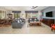 Inviting living room with neutral walls, plush seating, and large windows that provide plenty of natural light at 16287 W Willow Creek Ln, Surprise, AZ 85374