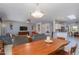 Open-concept living room with an adjoining kitchen and dining area at 16287 W Willow Creek Ln, Surprise, AZ 85374