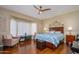 Comfortable main bedroom showcasing warm tones, natural light, and a serene ambiance at 16287 W Willow Creek Ln, Surprise, AZ 85374