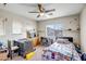 Functional bedroom equipped with a desk, shelves, carpet flooring, and a window at 17766 W Caribbean Ln, Surprise, AZ 85388