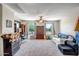 Spacious bonus room with a ceiling fan, ample space for various activities, and lots of natural light at 17766 W Caribbean Ln, Surprise, AZ 85388