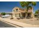 Charming two-story home featuring a spacious three-car garage and low maintenance desert landscaping at 17766 W Caribbean Ln, Surprise, AZ 85388