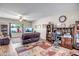 Spacious living room featuring hardwood floors, a comfortable couch, and a large window at 17766 W Caribbean Ln, Surprise, AZ 85388