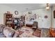 Comfortable office space with a desk, bookshelves, and a cozy chair next to a bright window at 17766 W Caribbean Ln, Surprise, AZ 85388