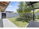 Private backyard oasis with lush green turf and mature landscaping for a serene and relaxing outdoor experience at 1861 W Navarro Ave, Mesa, AZ 85202
