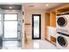 Modern bathroom with a glass shower and in-unit washer/dryer at 1861 W Navarro Ave, Mesa, AZ 85202