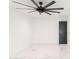 Bedroom features marble floors, a black door and a large ceiling fan with integrated lighting at 1861 W Navarro Ave, Mesa, AZ 85202