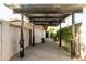 The detached carport features a ceiling fan for comfort, and gives private access to the front and back yard areas at 1861 W Navarro Ave, Mesa, AZ 85202