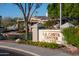 A beautiful community center with lush landscaping, including flowering plants, is surrounded by mature trees and community pride at 1861 W Navarro Ave, Mesa, AZ 85202