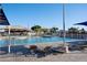 Enjoy a swim in this luxurious, pristine community pool with nearby lounging areas and playground at 1861 W Navarro Ave, Mesa, AZ 85202