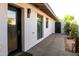 This property features exterior access doors, windows for light, and updated stucco and paint to give it a sleek look at 1861 W Navarro Ave, Mesa, AZ 85202