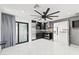 Modern kitchen features stainless steel appliances and a sliding glass door to the patio at 1861 W Navarro Ave, Mesa, AZ 85202