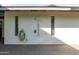 This outdoor shower features dual shower heads, a sleek design and is surrounded by two large windows for light and privacy at 1861 W Navarro Ave, Mesa, AZ 85202