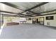 Covered patio area featuring a spa, pool table, outdoor tv, and modern tiling - perfect for entertaining guests at 1861 W Navarro Ave, Mesa, AZ 85202