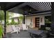 Stylish outdoor patio features comfortable seating, a modern pergola, and a serene garden view at 1861 W Navarro Ave, Mesa, AZ 85202