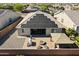Aerial view of backyard with patio, gas fire pit, grill, pergola and solar panels at 18865 W Mescal St, Surprise, AZ 85388
