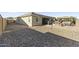 The house has a patio, grill, hot tub, and desert landscaping in the backyard at 18865 W Mescal St, Surprise, AZ 85388