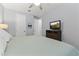 Bright bedroom with ceiling fan, carpet and comfortable queen bed at 18865 W Mescal St, Surprise, AZ 85388