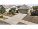 A charming single-story home boasts desert landscaping and a two-car garage in a peaceful suburban neighborhood at 18865 W Mescal St, Surprise, AZ 85388