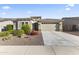 Charming single-story home with a well-maintained yard and two-car garage at 18865 W Mescal St, Surprise, AZ 85388