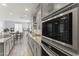 Modern kitchen showcasing stainless steel appliances and a view into the dining area at 18865 W Mescal St, Surprise, AZ 85388
